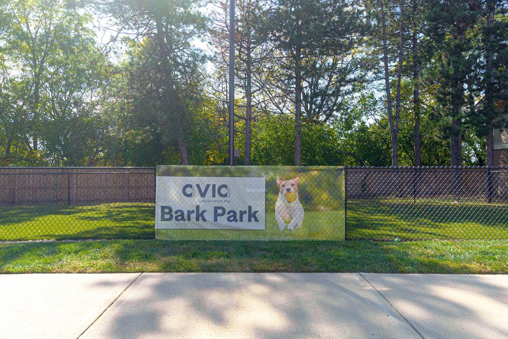 a sign for cvc bark park with a dog on it